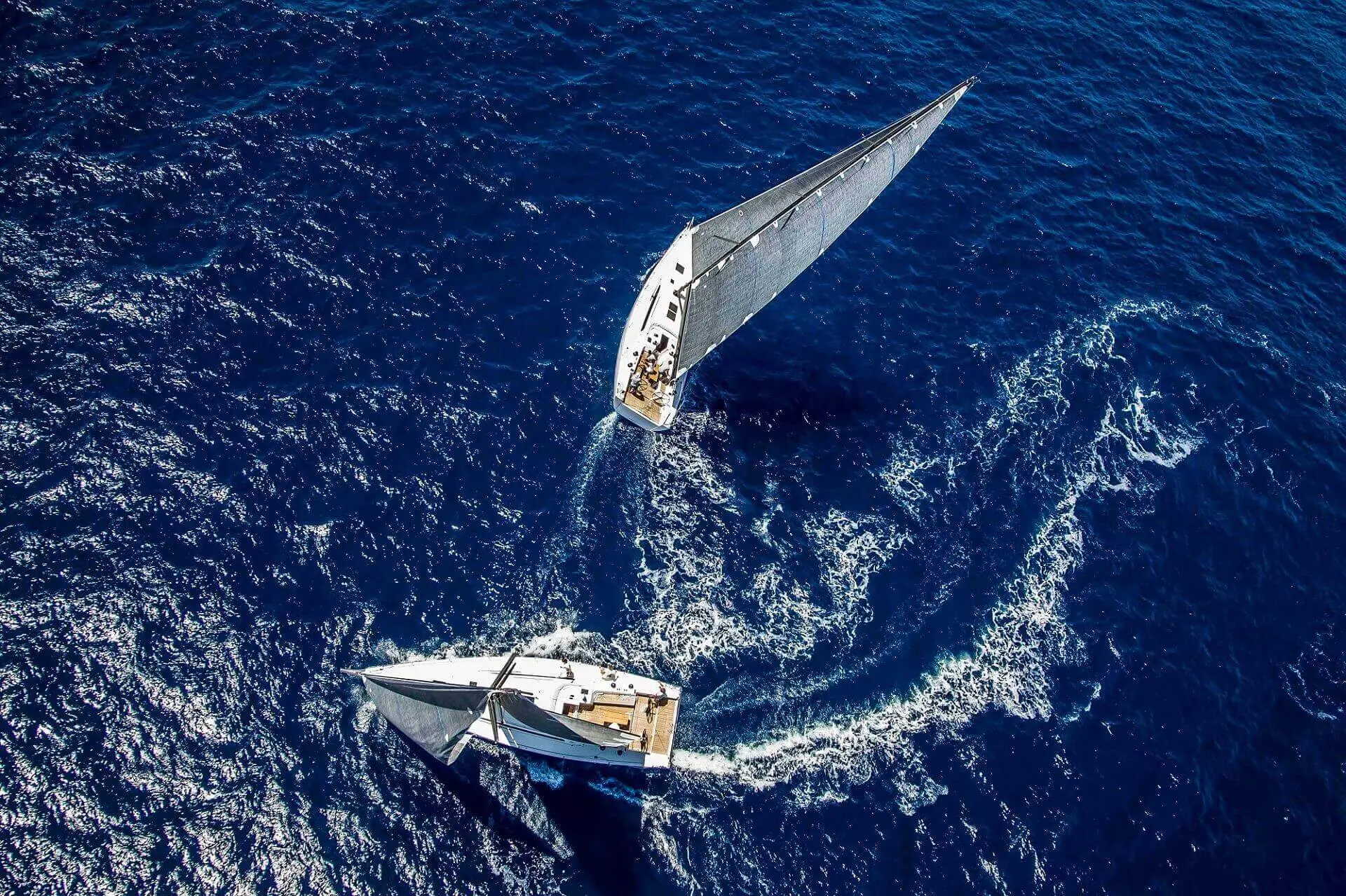 Two boats sailing and turning their direction